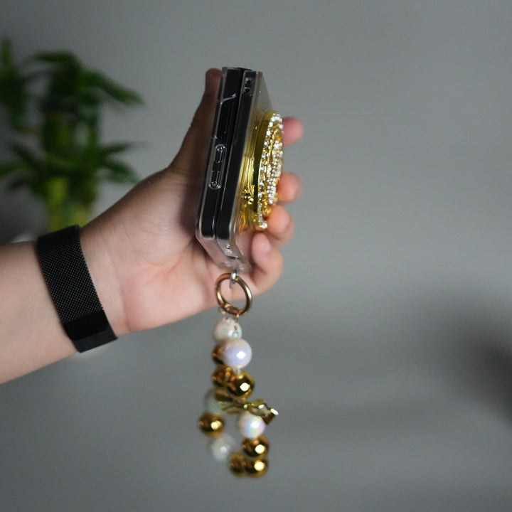 Galaxy Z Flip 7 Luxury Spinning Dollar Bling Case | Crystal Clear Cover with Pearl Strap