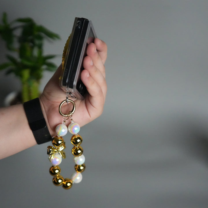 Galaxy Z Flip 7 Luxury Spinning Dollar Bling Case | Crystal Clear Cover with Pearl Strap