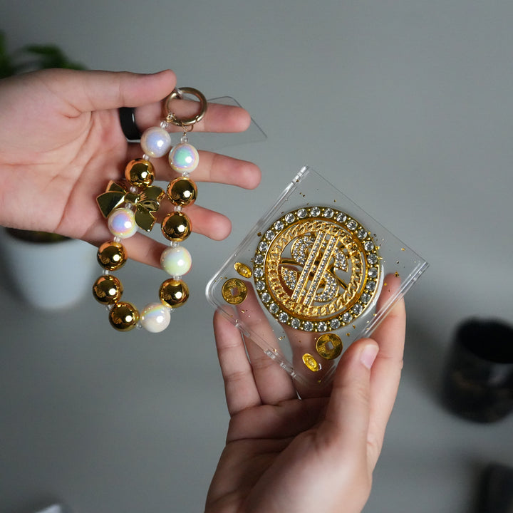 Galaxy Z Flip 7 Luxury Spinning Dollar Bling Case | Crystal Clear Cover with Pearl Strap