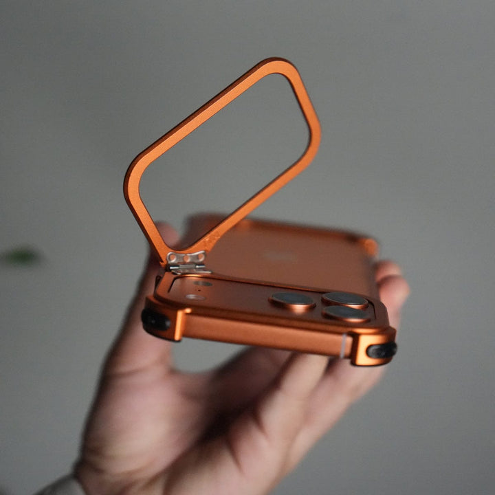 FRATO Aeroflex Metal iPhone 17 Pro max 9-Shaped Frameless Metal Bumper Case with Hidden Lens Stand | Shockproof Aviation-Grade Alloy Frame