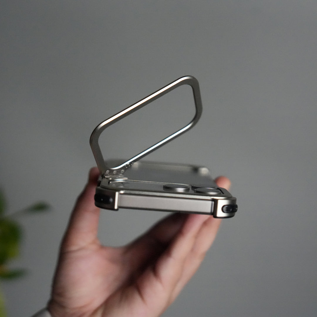 iPhone 17 Pro 9-Shaped Frameless Metal Bumper Case with Hidden Lens Stand | Shockproof Aviation-Grade Alloy Frame