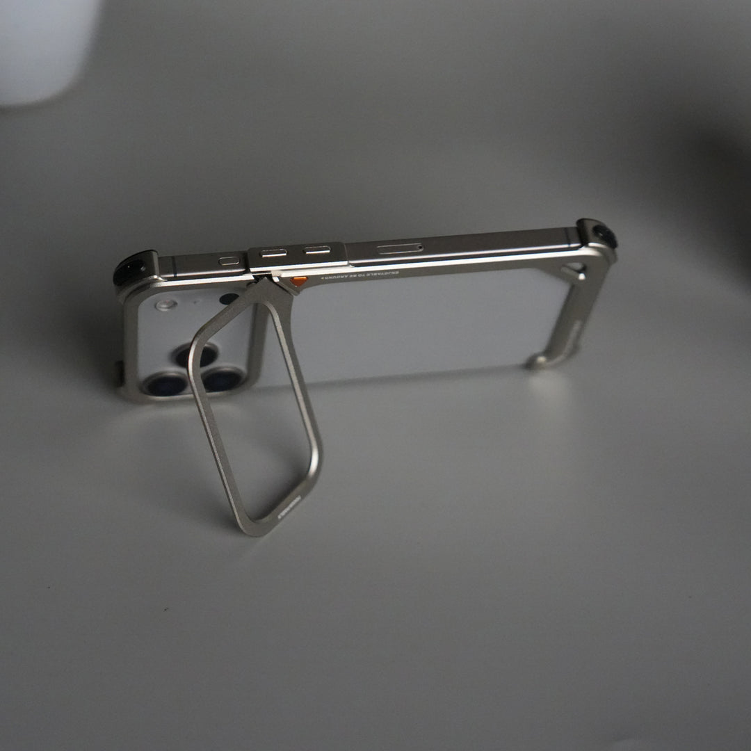 iPhone 17 Pro 9-Shaped Frameless Metal Bumper Case with Hidden Lens Stand | Shockproof Aviation-Grade Alloy Frame